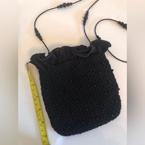 Black beaded knit handbag.